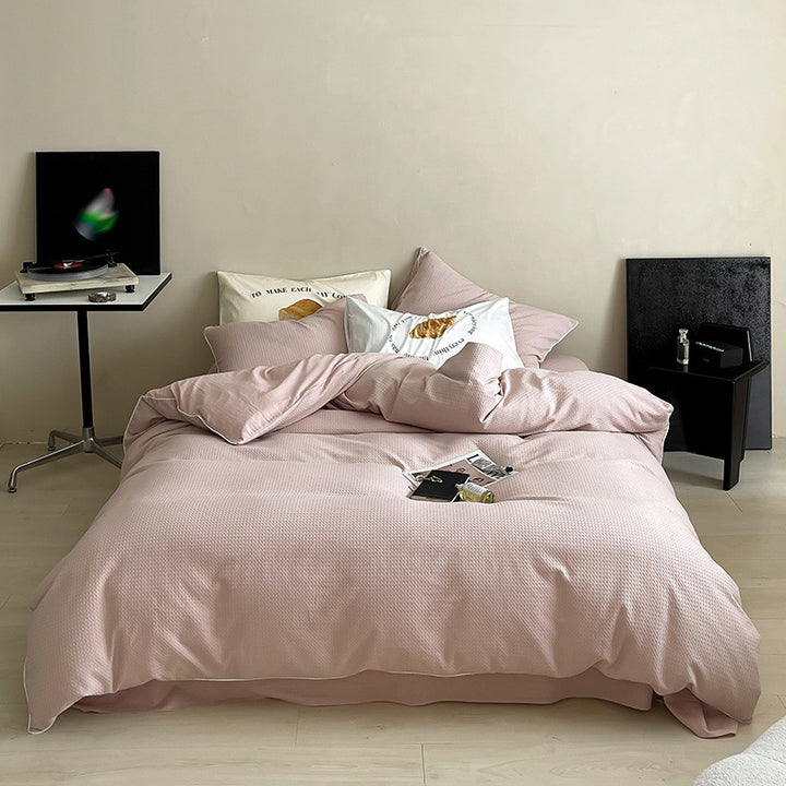 Textured cotton waffle duvet cover with pillowcases and fine contrasting piping