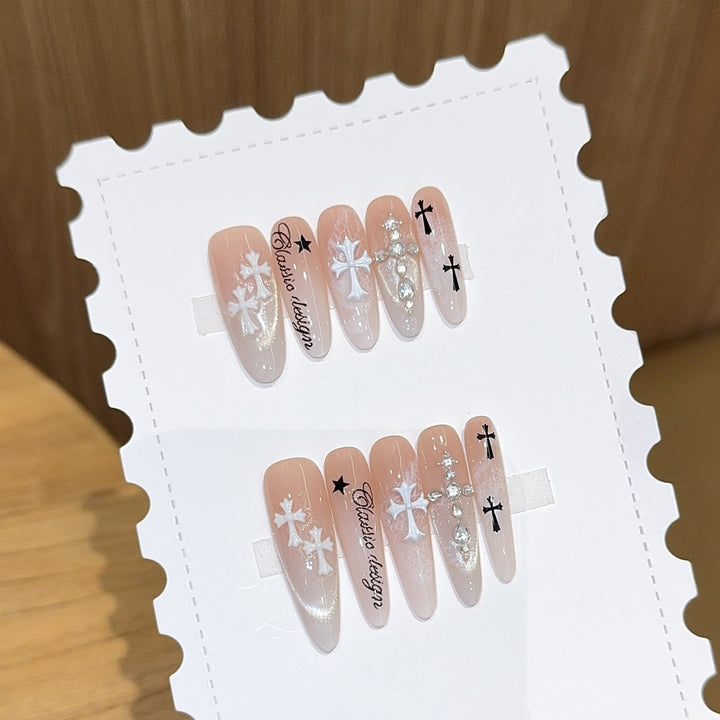 Artificial nail tips with cross and glitter motifs Stornfield