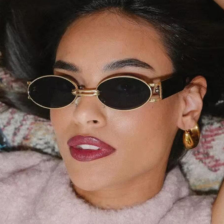 Women oval-shaped sunglasses with golden accents and stylish frame Stornfield