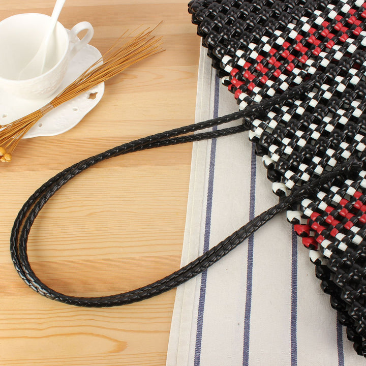 Stylish handbag made of braided material Stornfield