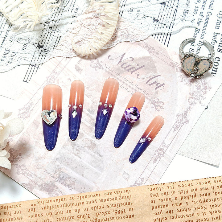 Artificial nails with glitter and elegant 3D applications Stornfield