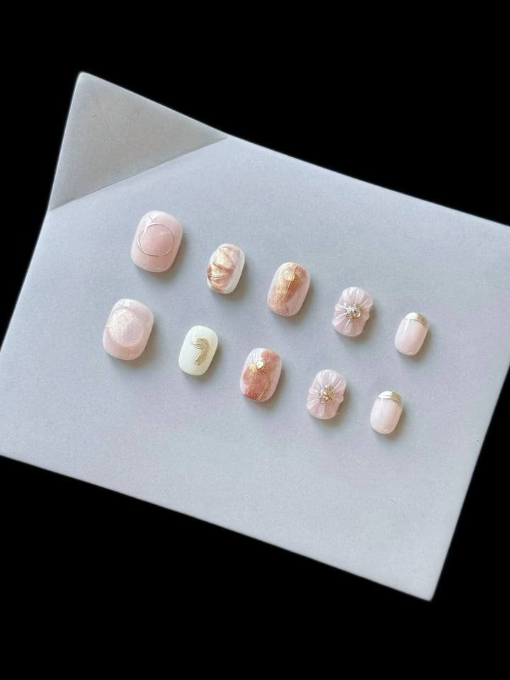 Artistic Press-On Nail Set with Decorative Floral Accents