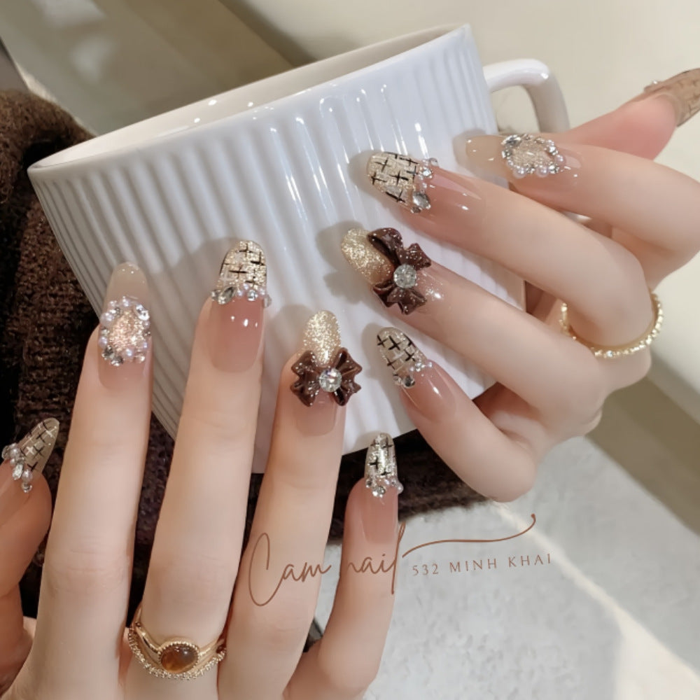 Decorative Press-On Nail Extensions with Bow and Rhinestone Accents Stornfield