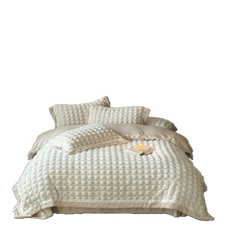 Quilted velvet bedding set with 3D waffle structure and decorative border Stornfield