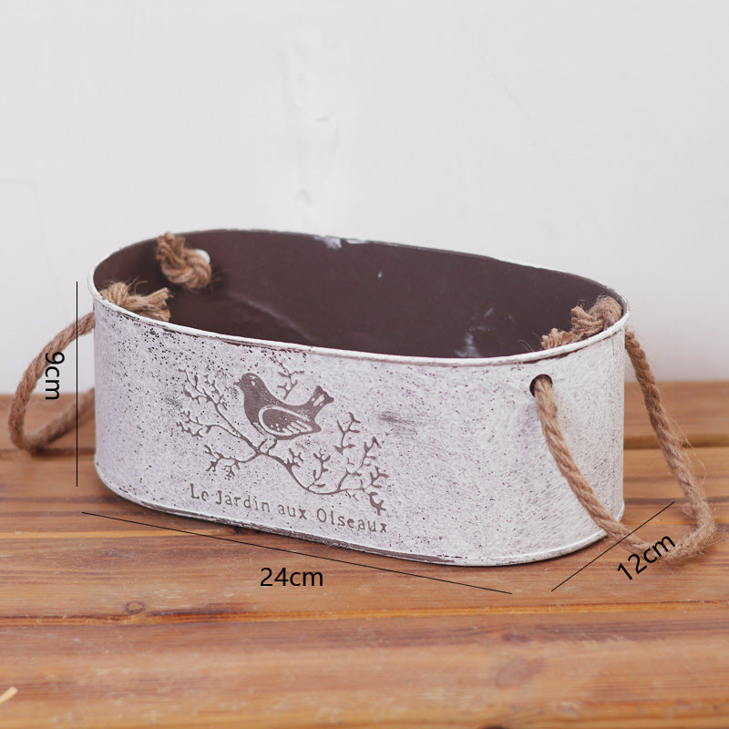 Decorative storage basket made of metal with natural design Stornfield