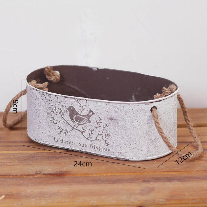 Decorative storage basket made of metal with natural design Stornfield
