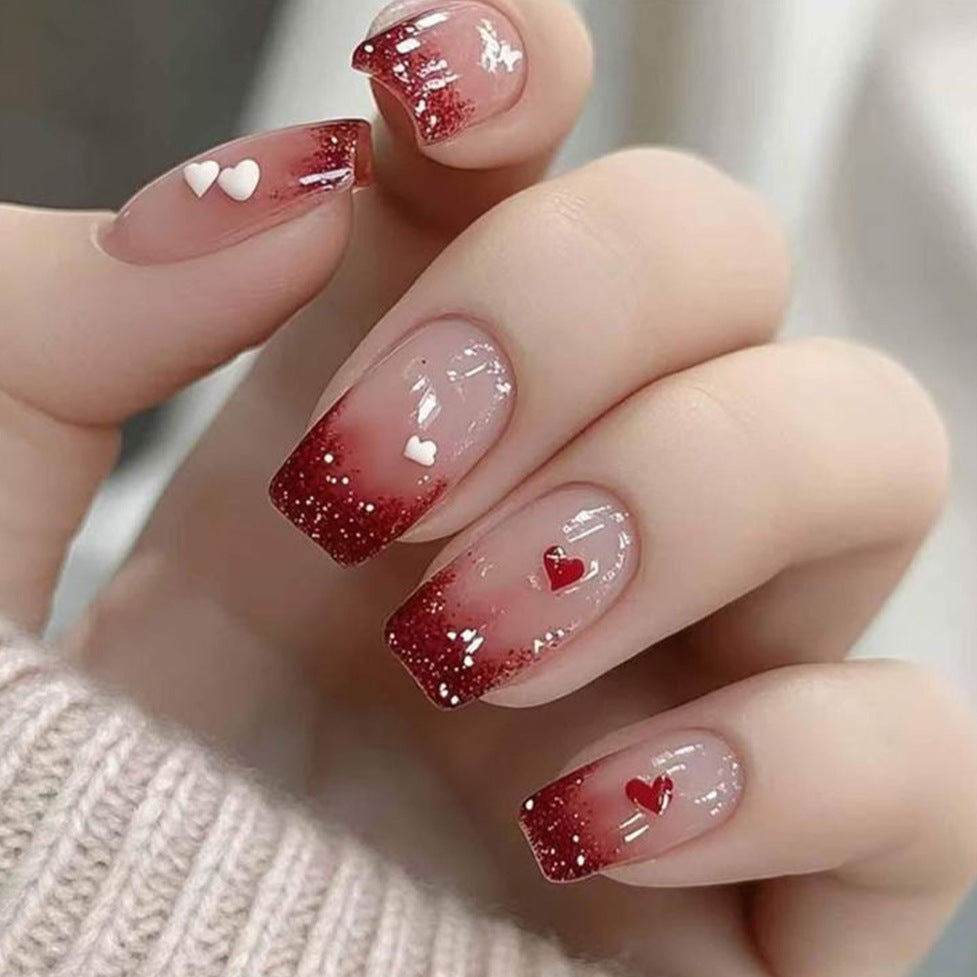 Romantic Nail Art with Heart Motifs Stornfield