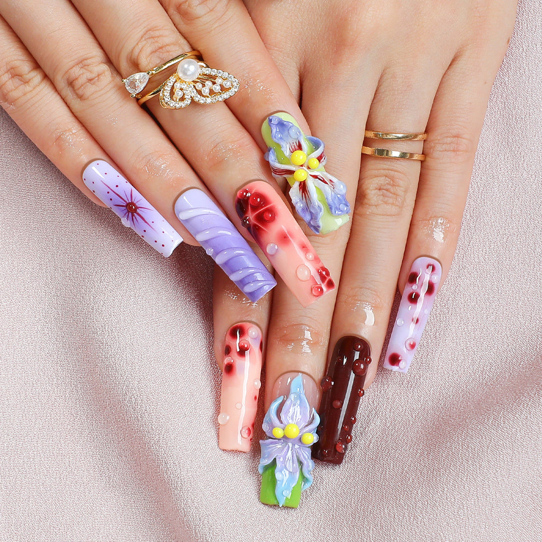 Creative artificial nail set with elegant floral design and glitter accents Stornfield