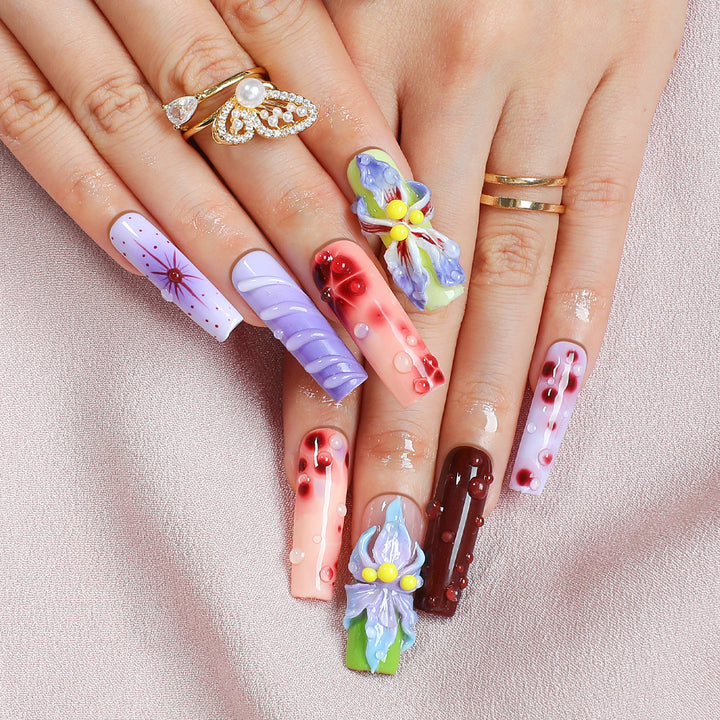 Creative artificial nail set with elegant floral design and glitter accents Stornfield