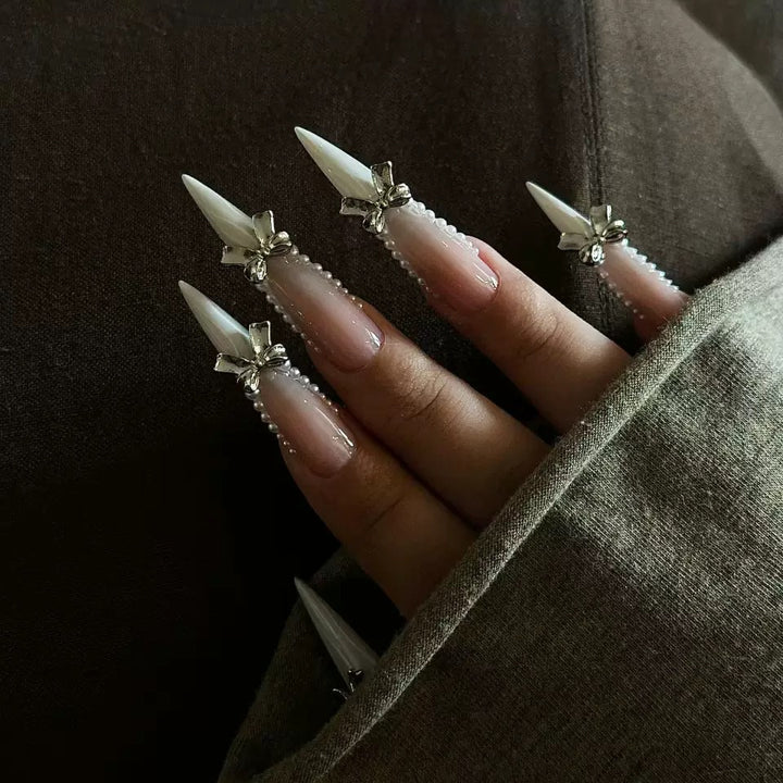 Elegant artificial nail set with 3D rhinestone details and pointed accents Stornfield