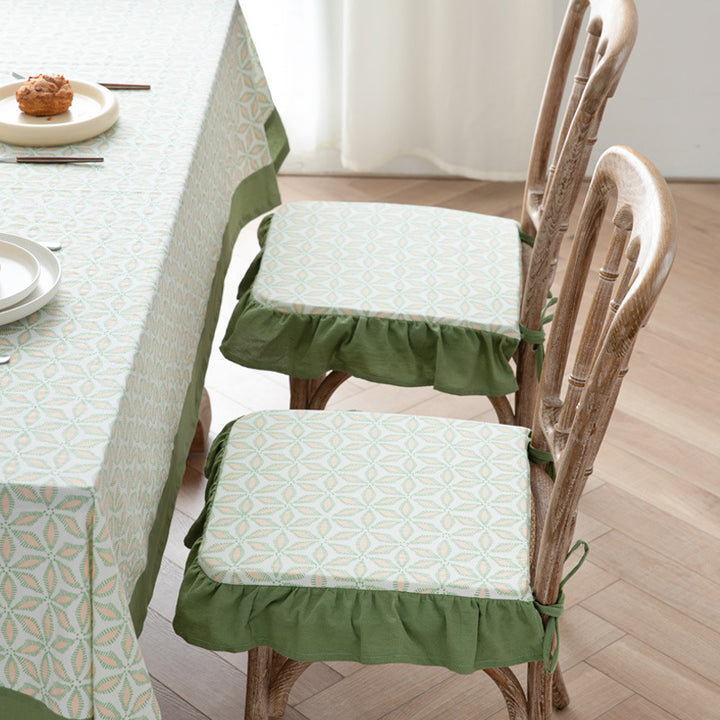 Padded chair seat cushion with tie straps and ruffled edge
