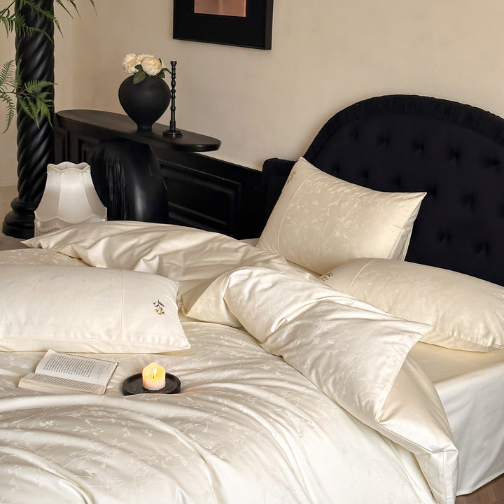 High-gloss satin bedding set with subtle floral jacquard and breathable comfort lining