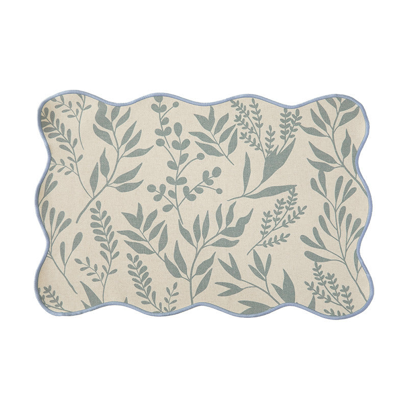 Shaped table set with curved contour and botanical leaf pattern Stornfield