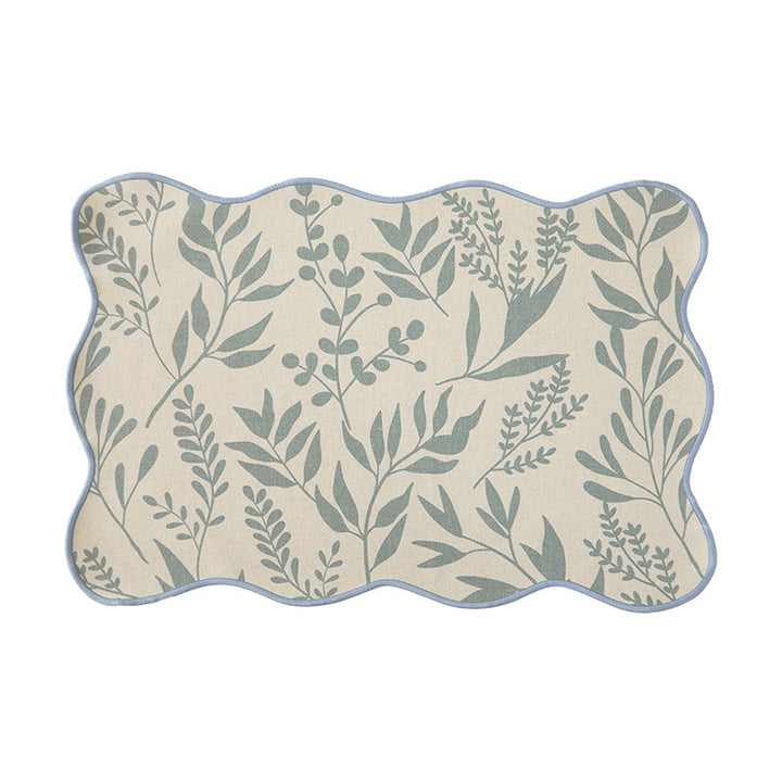 Shaped table set with curved contour and botanical leaf pattern Stornfield