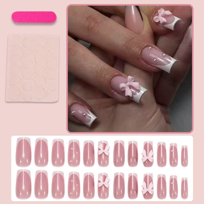 Nail art set with playful ribbon designs and elegant accents Stornfield