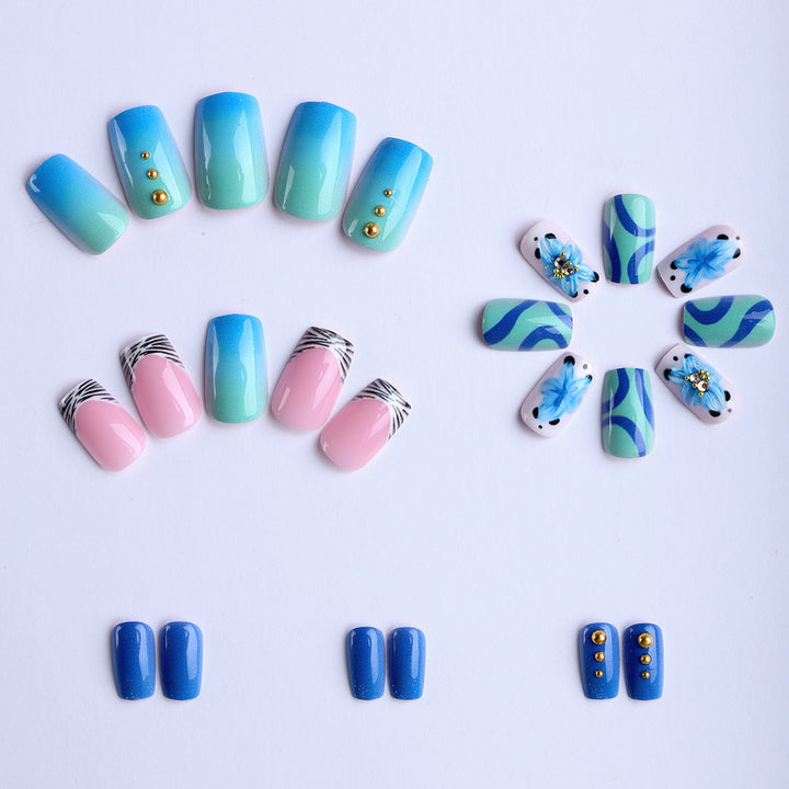 Artificial fingernails with handcrafted designs Stornfield