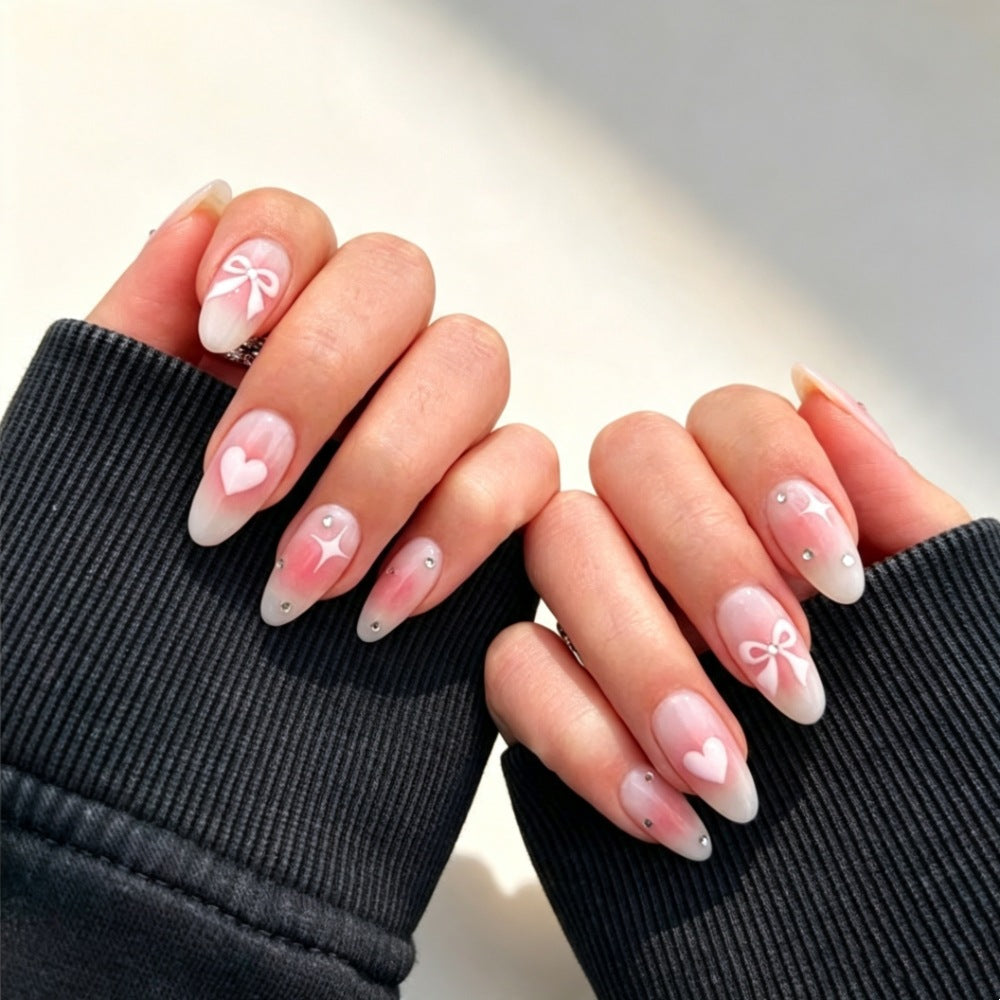Artificial nails with romantic heart and bow design Stornfield