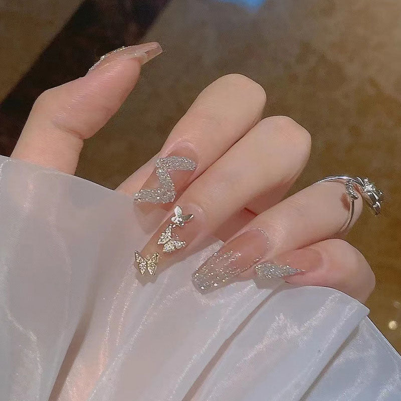 Artificial nails with heart accent and glamorous decorations Stornfield
