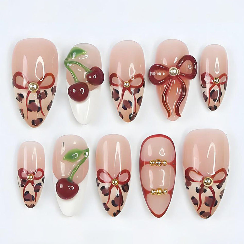 Artificial nail set with creative ribbon and fruit designs Stornfield