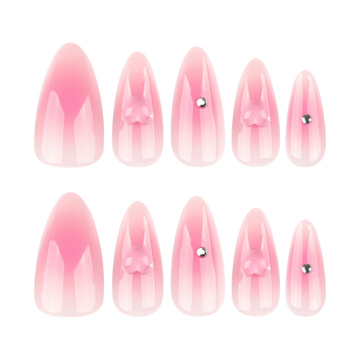 Artful stiletto nails with heart design and glitter accents Stornfield