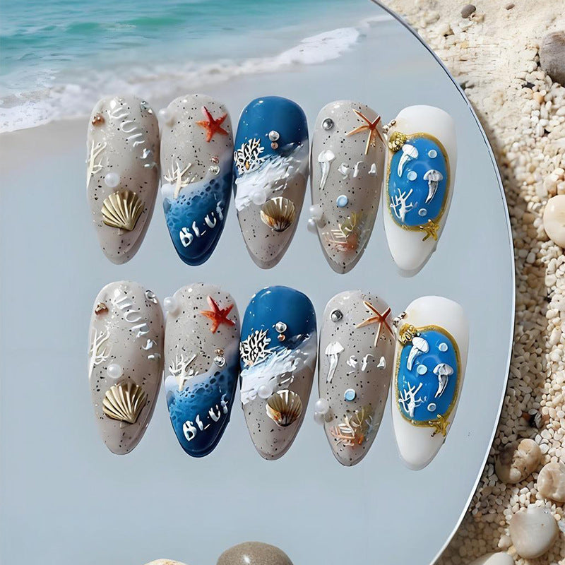 Artificial nail set with maritime designs and elegant embellishments Stornfield