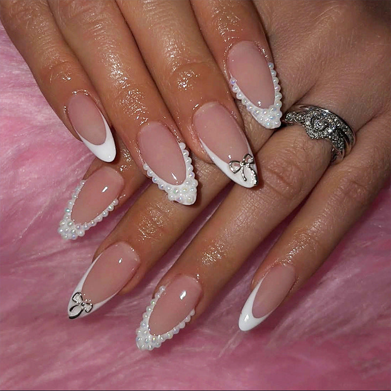 Glamorous artificial nail set with elegant bows and glitter accents Stornfield