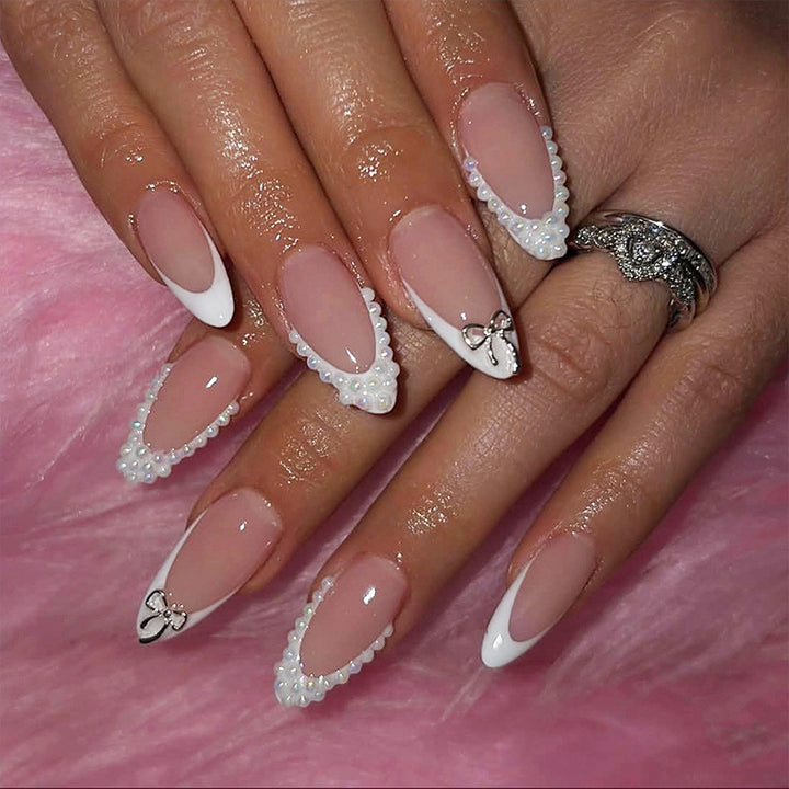 Glamorous artificial nail set with elegant bows and glitter accents Stornfield