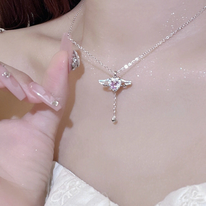 Playful angel neck chain with heart and wings Stornfield