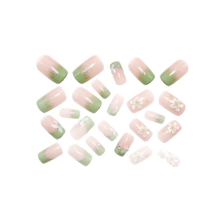 Artificial nails with floral accents and glitter coating Stornfield