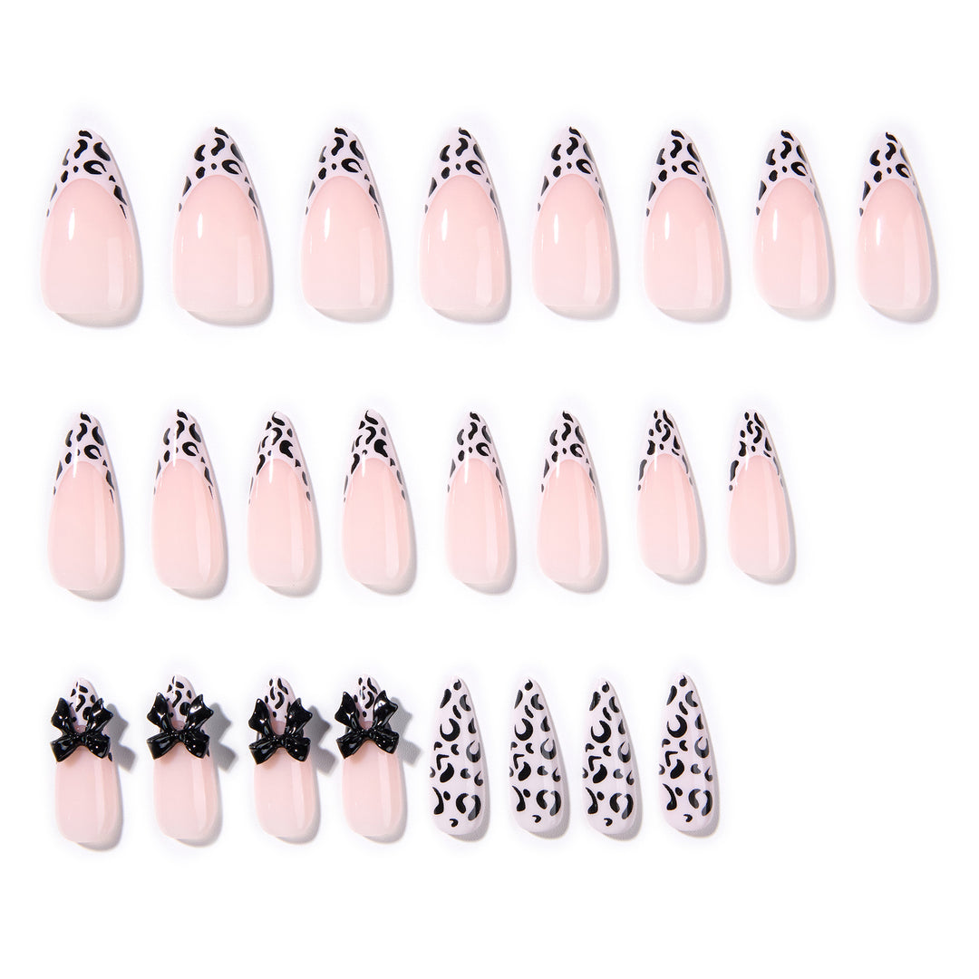 Artful Stiletto Nails with Leopard Print and Bow Accent Stornfield