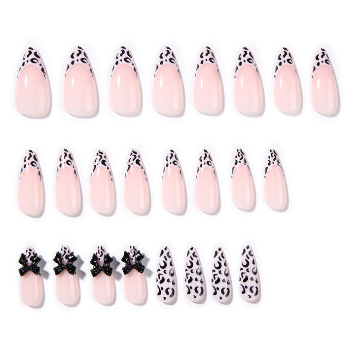 Artful Stiletto Nails with Leopard Print and Bow Accent Stornfield