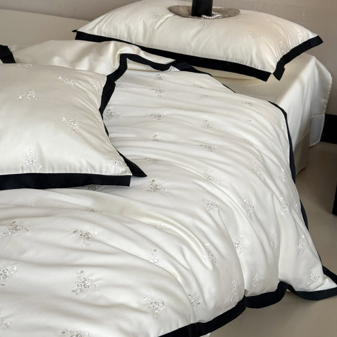 Noble cotton satin bedding set with tone-on-tone floral embroidery and contrasting piping