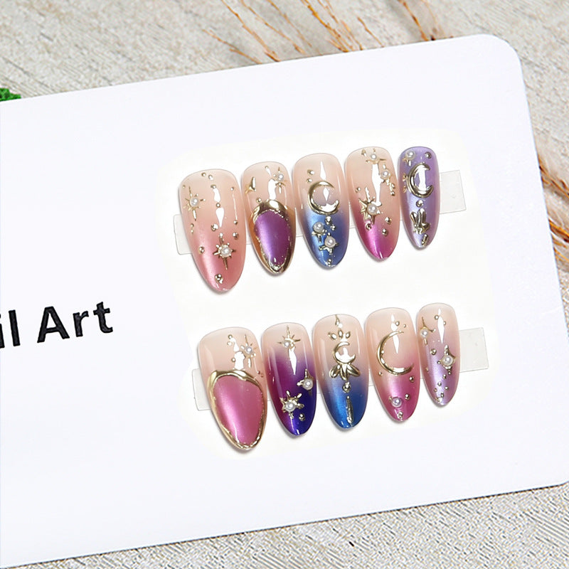 Glamorous artificial nails with star and moon motifs Stornfield