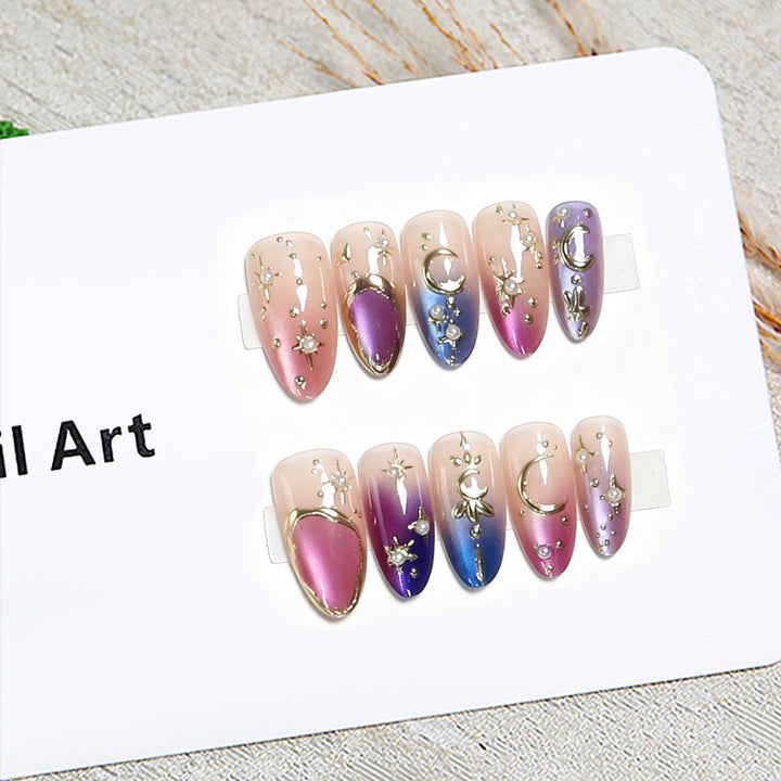 Glamorous artificial nails with star and moon motifs Stornfield