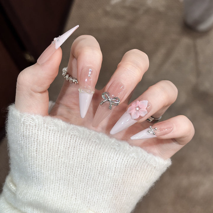 Decorative Stiletto Press-On Nails with Floral Accents and Gem Details