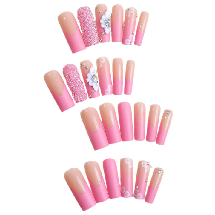 Acrylic nail set with sparkling glitter and delicate flower decorations Stornfield