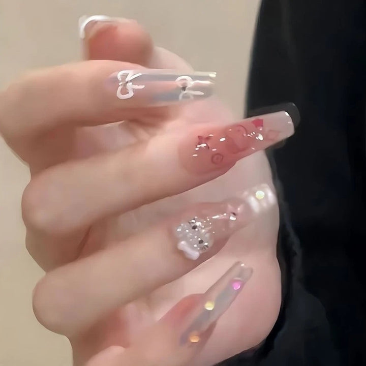 Artistic Press-On Nail Extensions with Floral Embellishments Stornfield