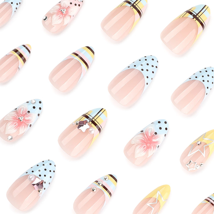 Creative nail designs with floral accents and glitter Stornfield