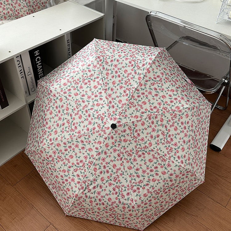 Women's folding umbrella with floral design and practical storage system Stornfield