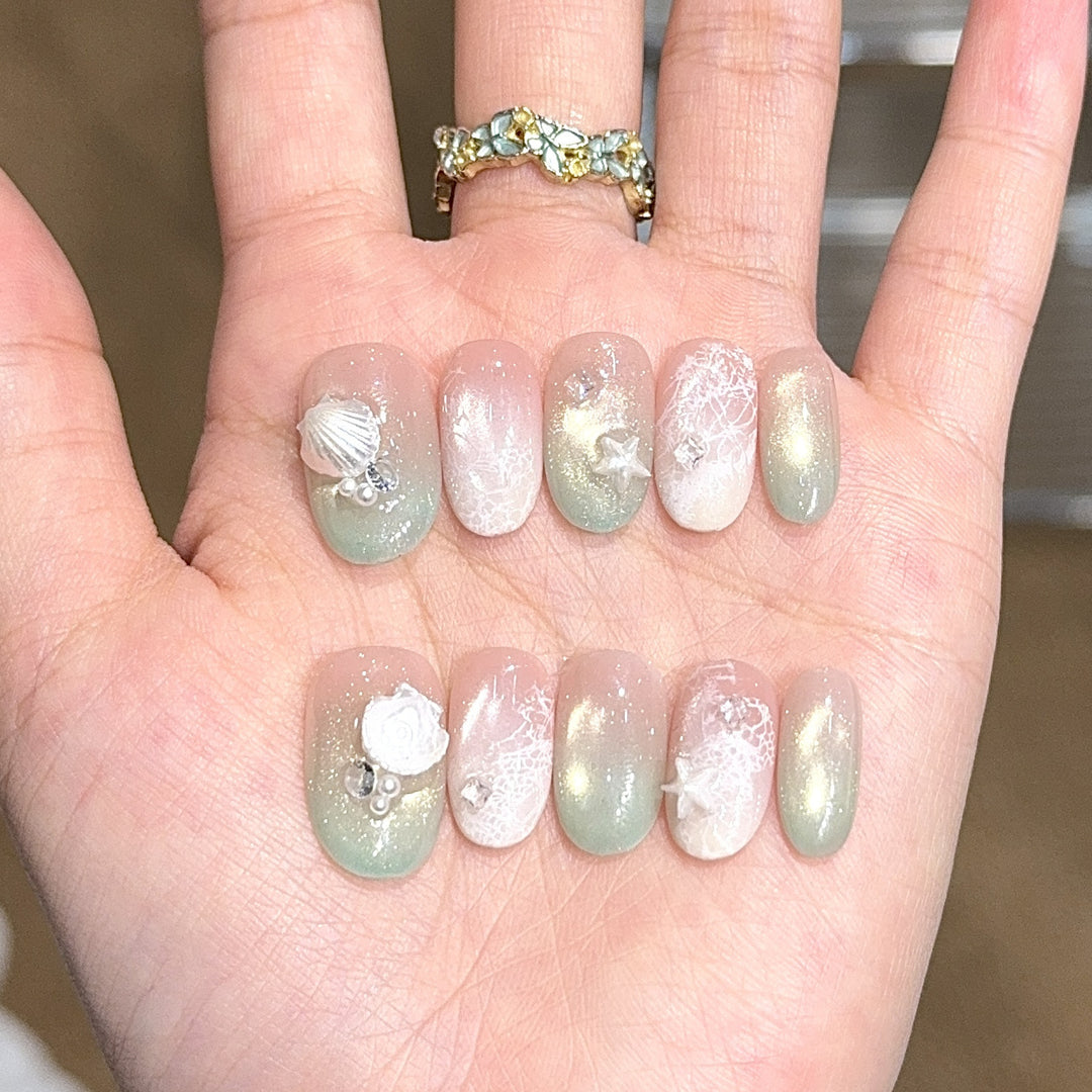 Artificial nail tips with maritime design and glitter effects Stornfield