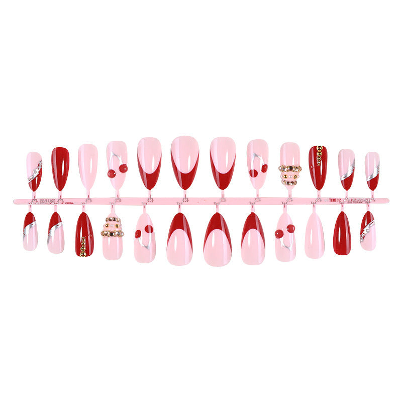 Artificial nail set with glamorous accents and cheerful patterns Stornfield