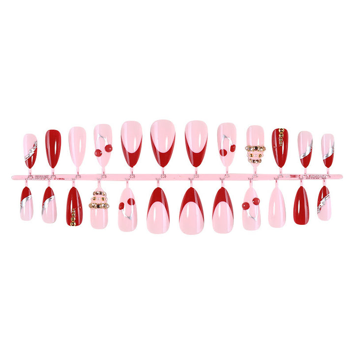Artificial nail set with glamorous accents and cheerful patterns Stornfield
