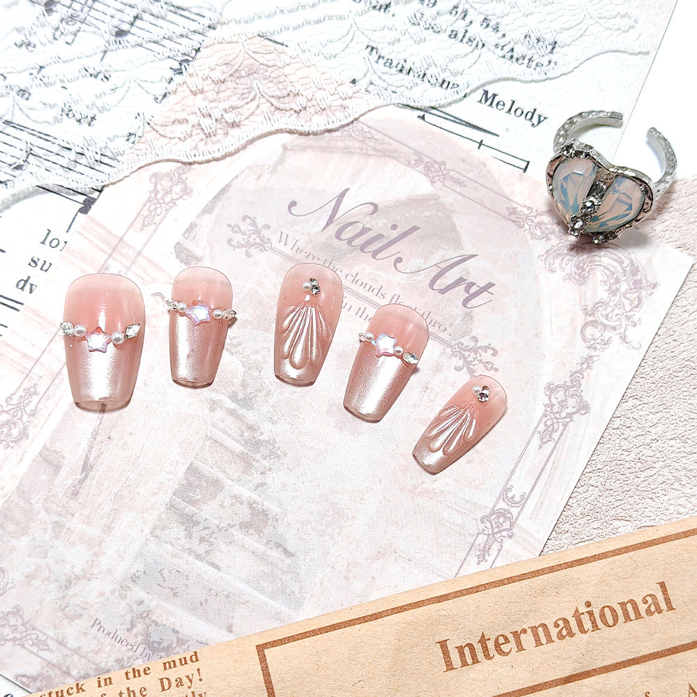 Exquisite artificial nails with glitter and pearl accents Stornfield