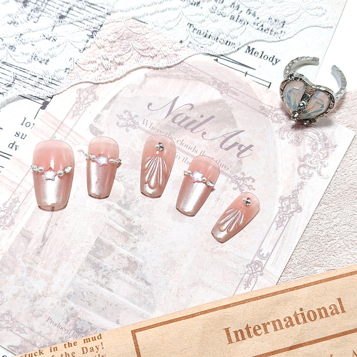 Exquisite artificial nails with glitter and pearl accents Stornfield