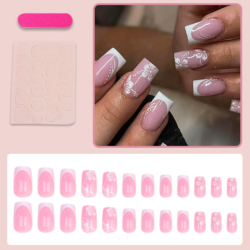 Artificial nail set with elegant French design and delicate flower patterns Stornfield