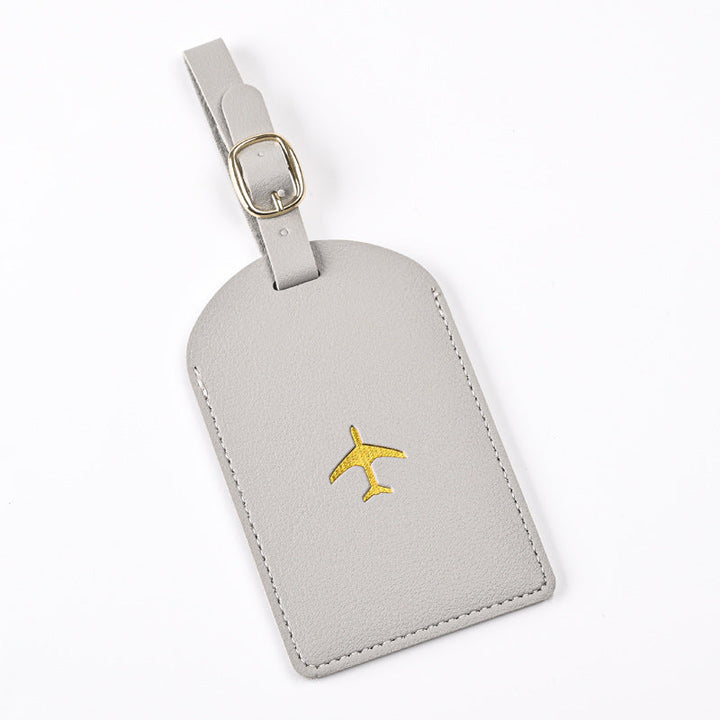 premium leather luggage tag with adjustable buckle strap and embossed airplane Stornfield