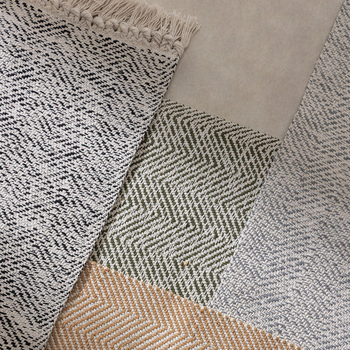 Braided runner rug with herringbone pattern and fringe edge Stornfield