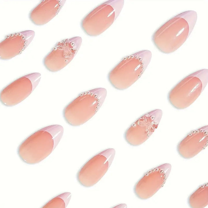 Art nail tips with delicate pearl and butterfly accents Stornfield