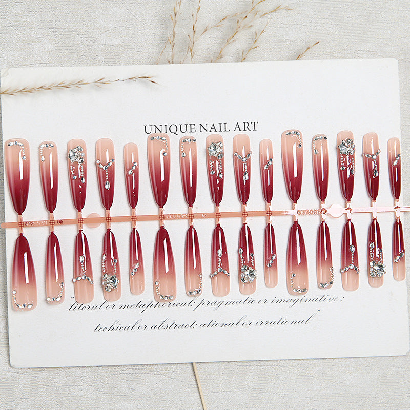 Artificial nails with elegant glitter and jewelry accents Stornfield
