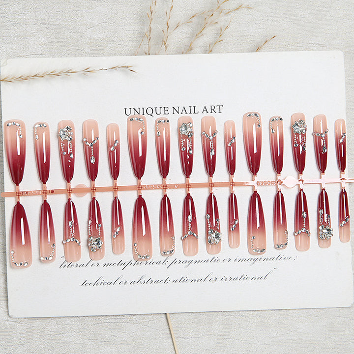 Artificial nails with elegant glitter and jewelry accents Stornfield
